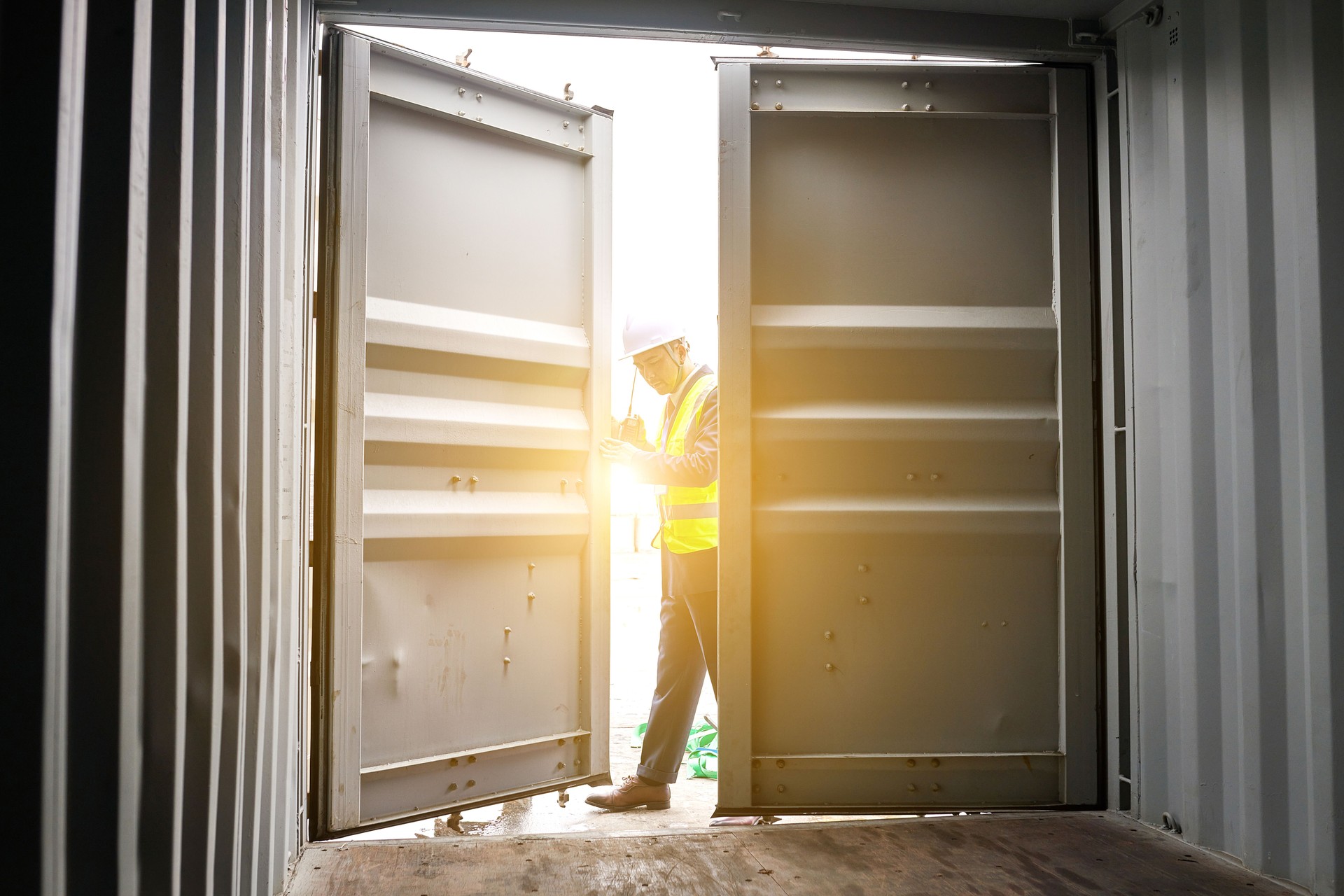 One Males Worker Opening and Examining Cargo Container