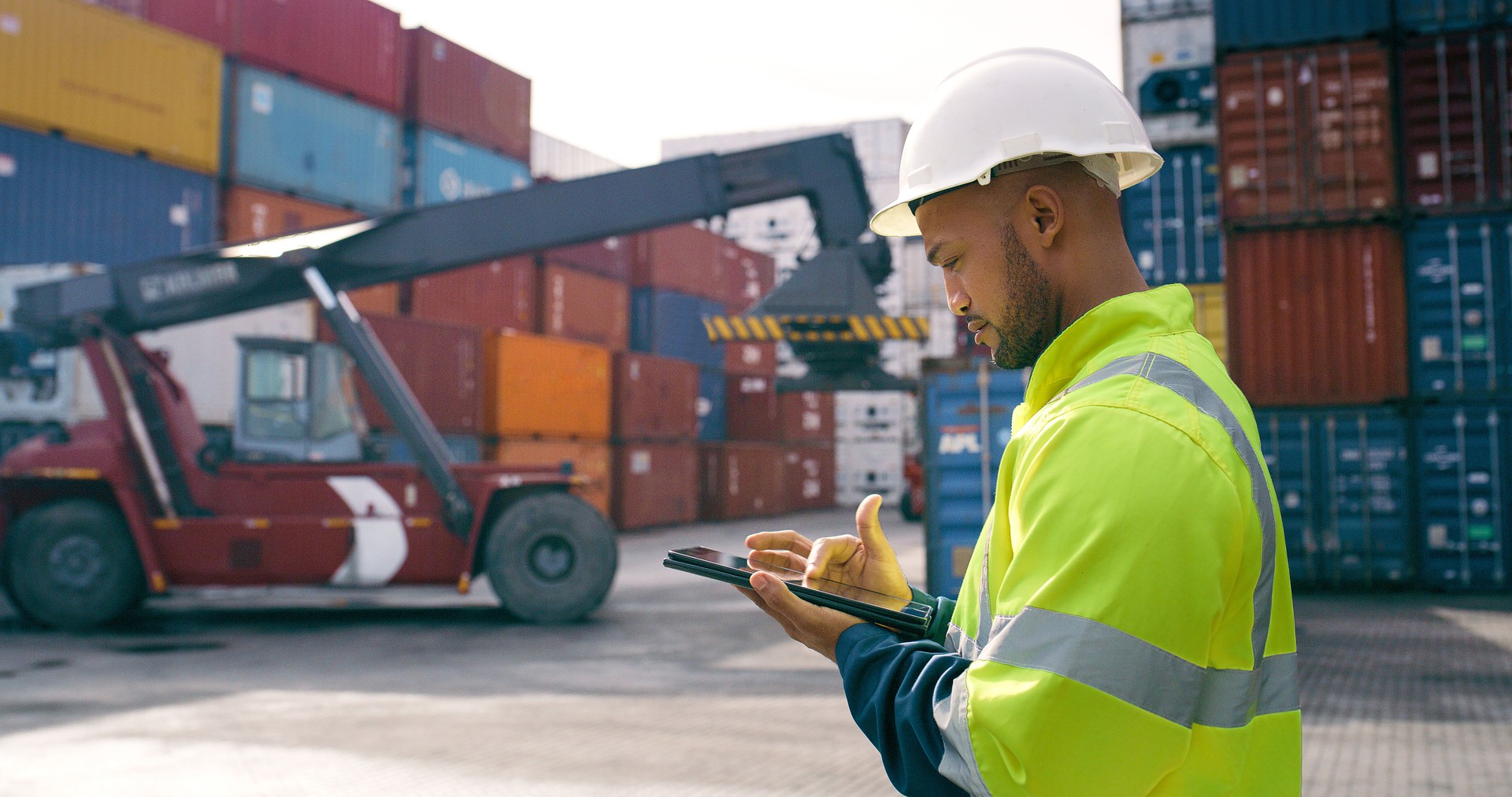 Black man, tablet and container outdoor for supply chain, shipping and logistics with quality control. Port supervisor, technology and cargo for inventory management, safety and freight inspection