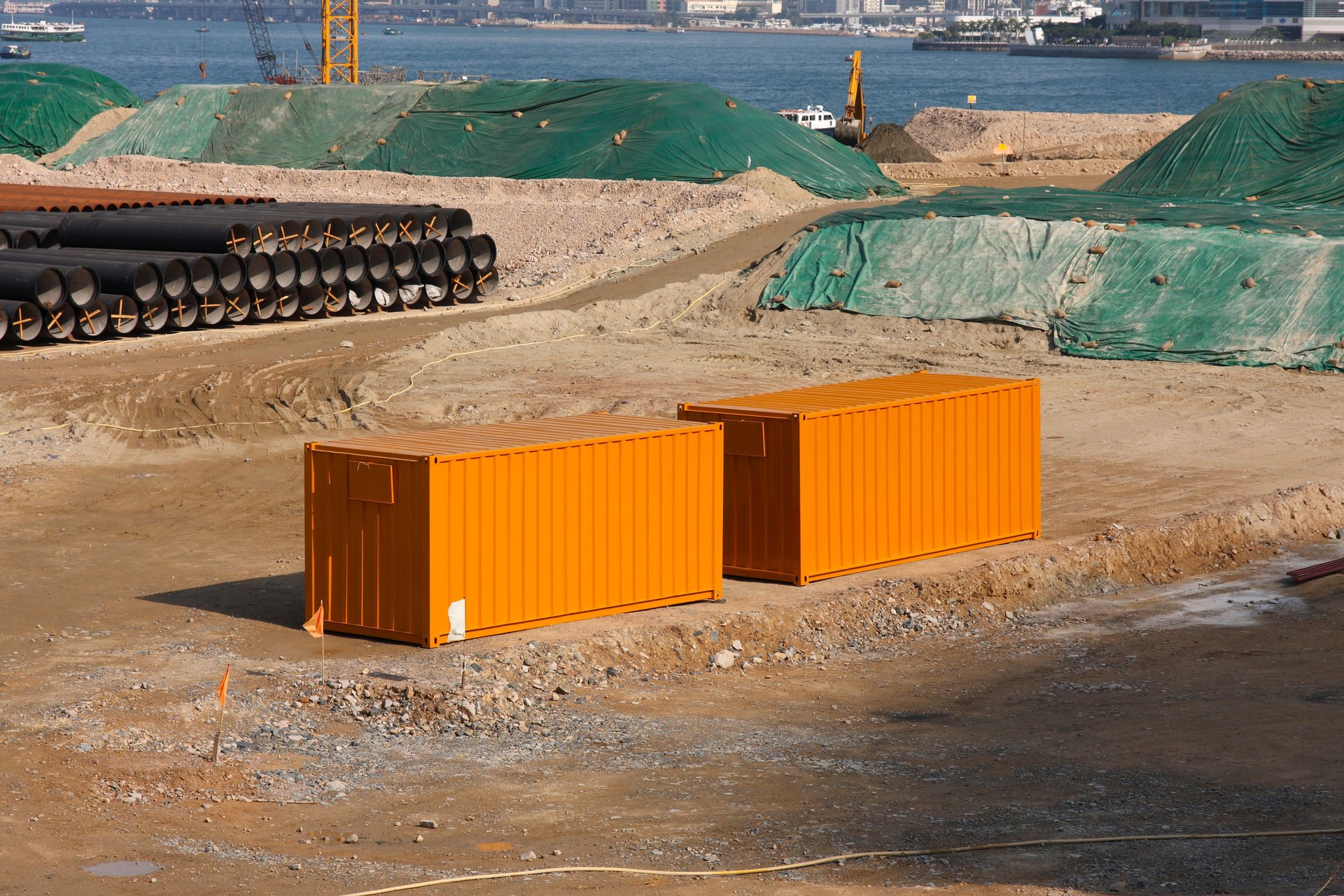 Orange cargo containers on work site